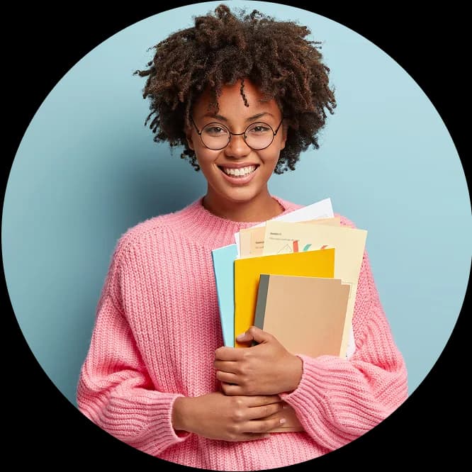 A student smiling while studying.